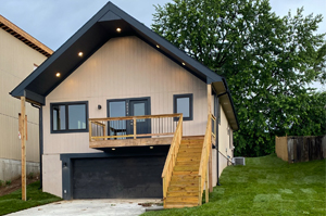 Modern new-construction home built by Entrepreneurs Enterprises at dusk
